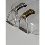 Silver steed stirrup silver pendant featuring silver and gold-toned horse saddle stirrups with metallic buckles