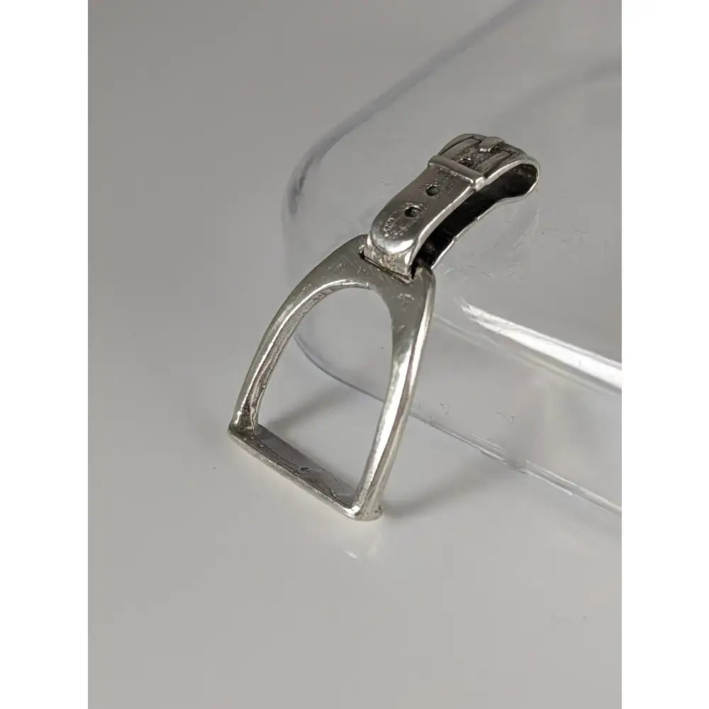 Silver steed stirrup silver pendant featuring a polished silver pendant with a buckle-style stirrup silver design