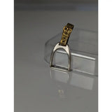 Silver steed stirrup silver pendant featuring a silver horsebit shape with a gold-tone buckle strap detail