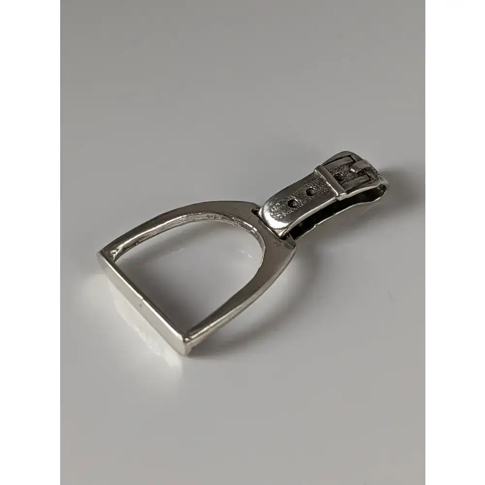 Silver steed stirrup keychain with polished metallic finish and buckle attachment featuring a silver pendant design