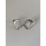 Silver steed stirrup stud earrings in sterling silver with a minimalist silver horse shoe design