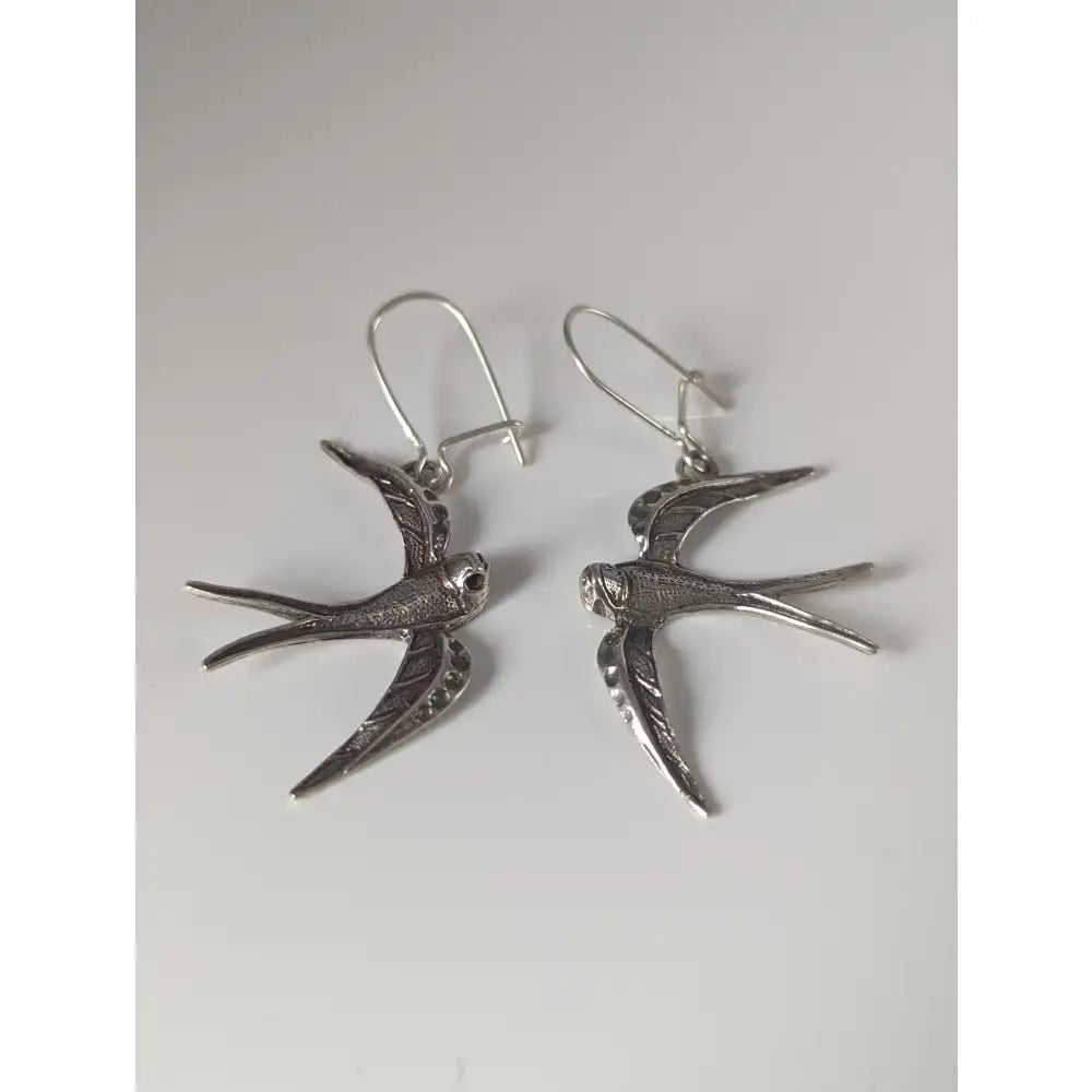 Silver steed swallow sterling silver dropped earrings with detailed feather textures and hook clasps