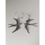 Silver steed swallow sterling silver dropped earrings with detailed feather textures and hook clasps