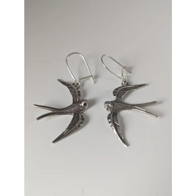 Silver steed swallow sterling silver dropped earrings with detailed feather textures and hook clasps
