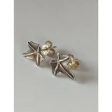 Silver steed sweetgum leaf stud earrings with textured sterling silver stars and gold-toned backings