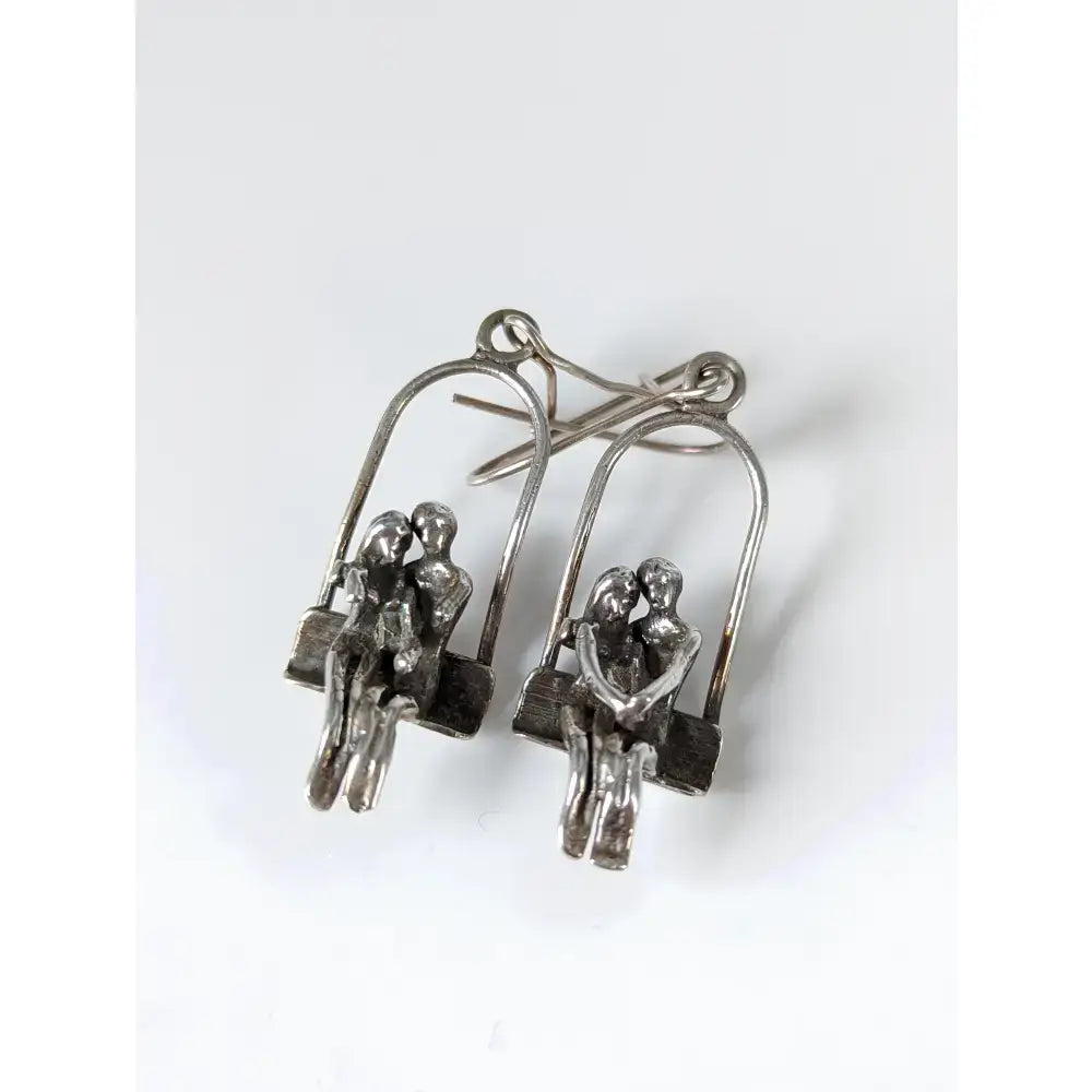 Silver steed swing couple dropped earrings featuring silver-toned metal swing seat loved up couple design