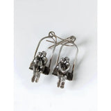 Silver steed swing couple dropped earrings featuring silver-toned metal swing seat loved up couple design