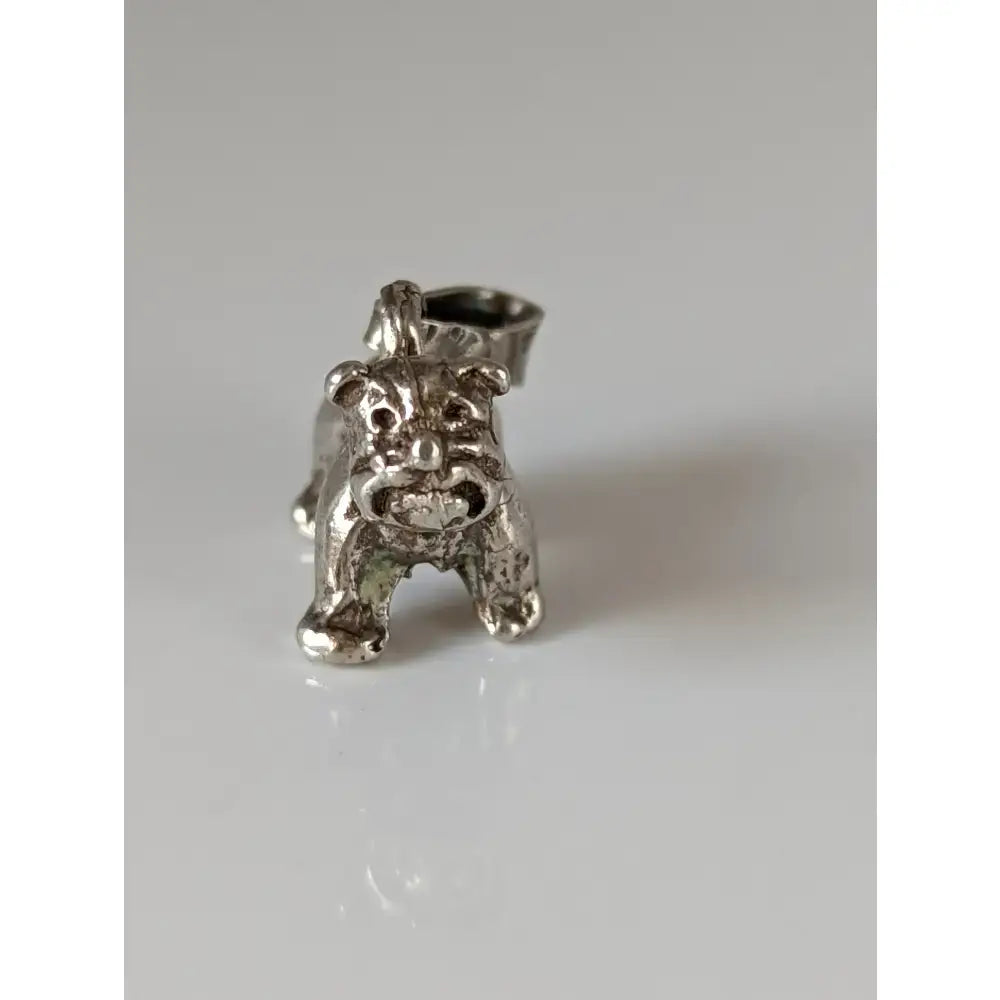 Silver steed terrier silver pendant featuring a textured silver pendant with detailed bulldog facial features