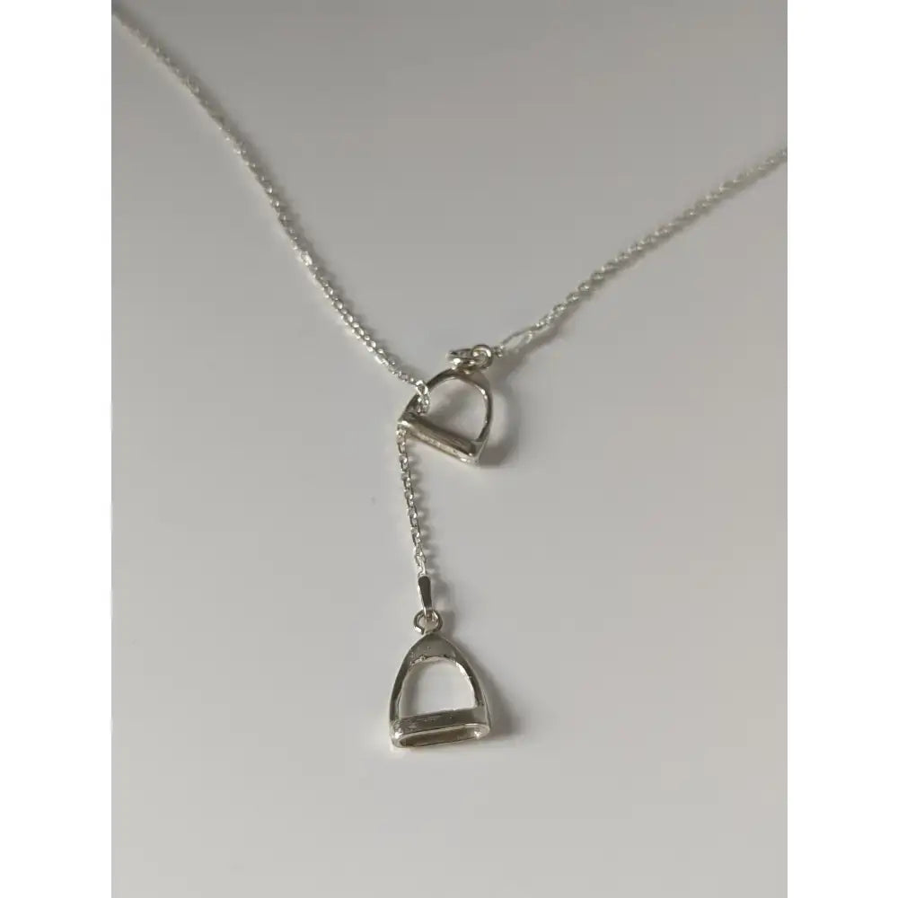 Silver steed thread necklace with delicate silver chain and double stirrups charm for a stylish stirrup silver necklace look