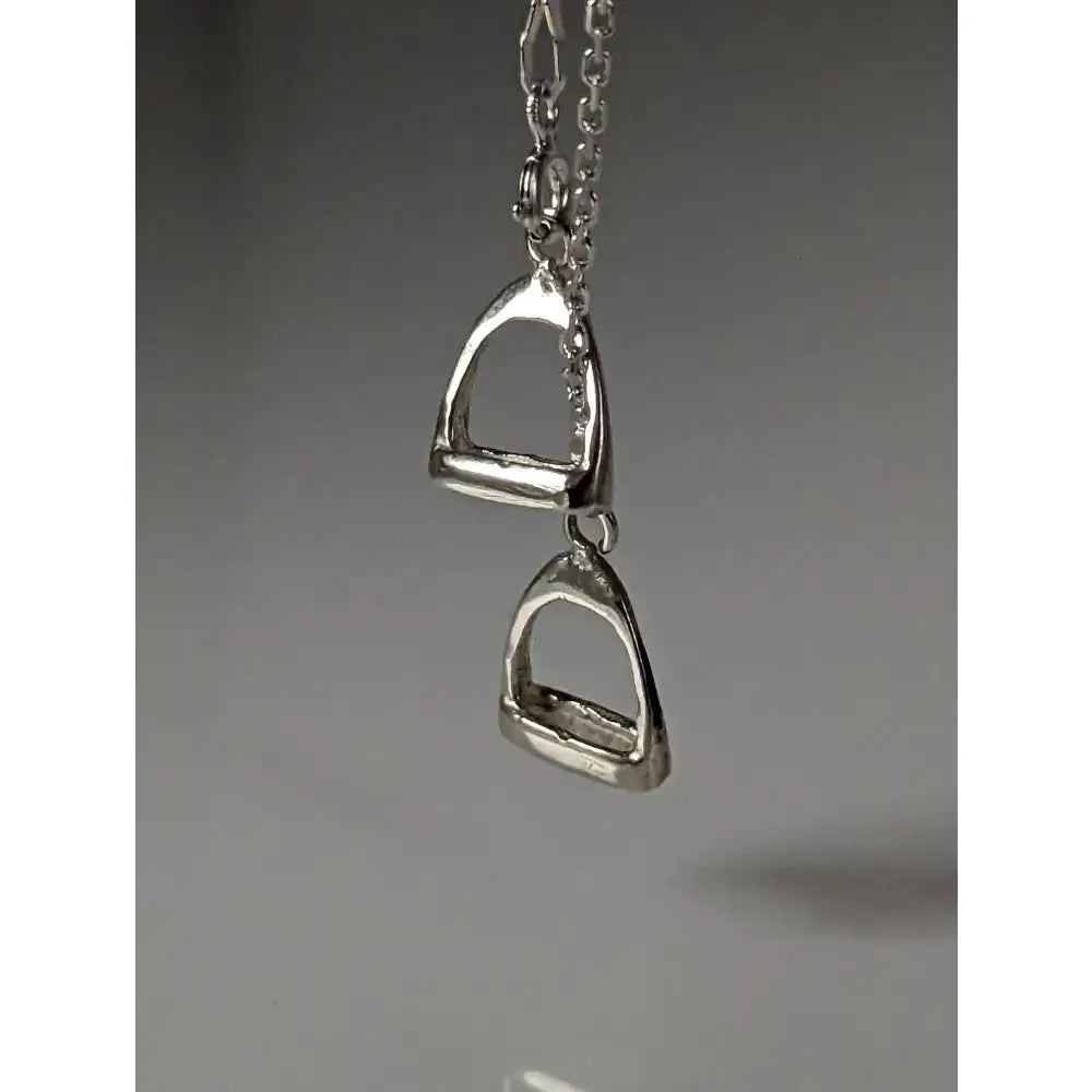 Silver steed thread necklace with a silver horsebit pendant and double stirrups charm for a stylish look