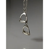 Silver steed thread necklace with a silver horsebit pendant and double stirrups charm for a stylish look