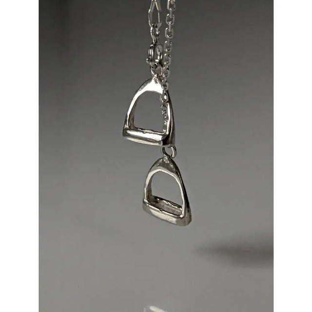 Silver steed thread necklace with a silver horsebit pendant and double stirrups charm for a stylish look