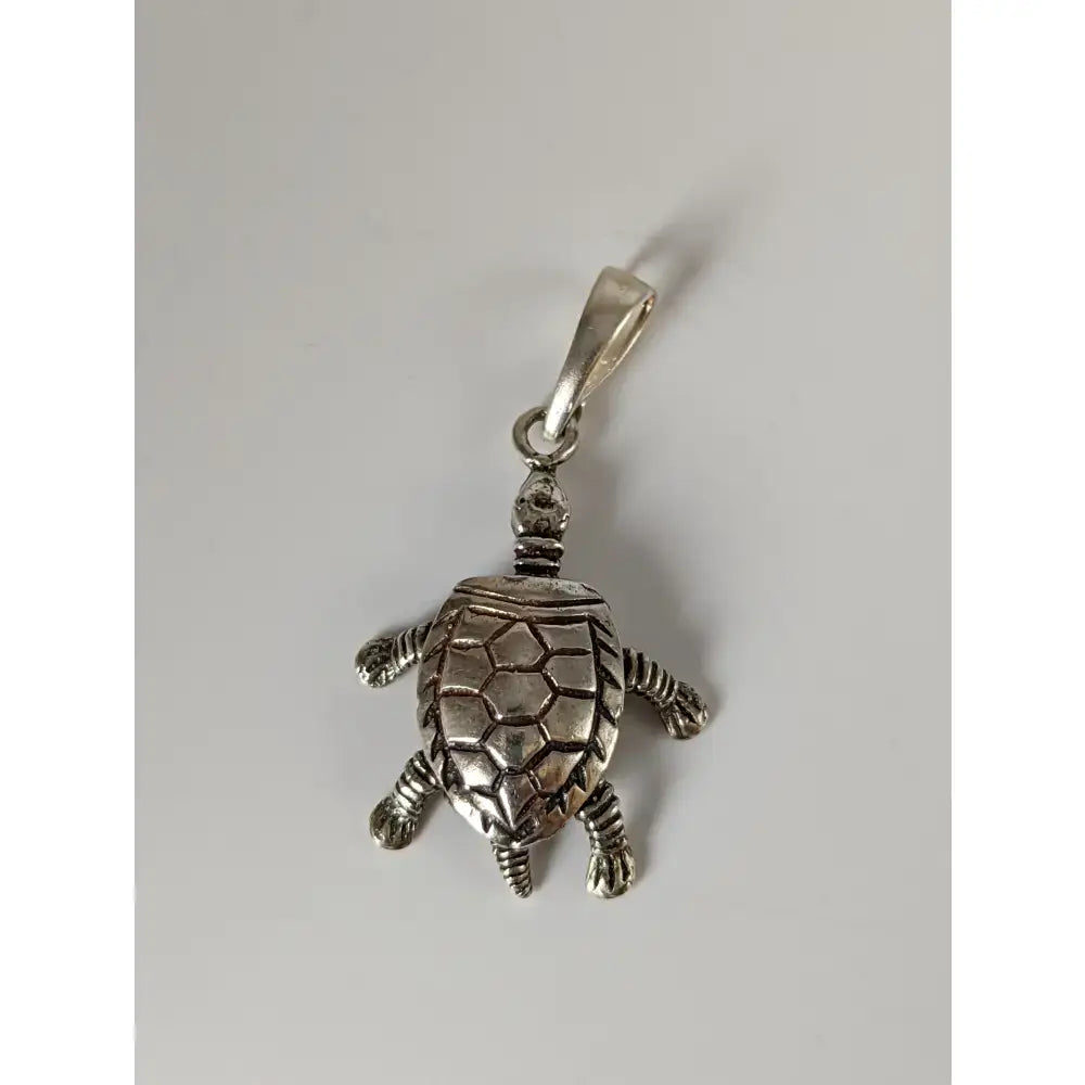 Silver steed tortoise silver pendant featuring a detailed shell and textured limbs in polished silver material