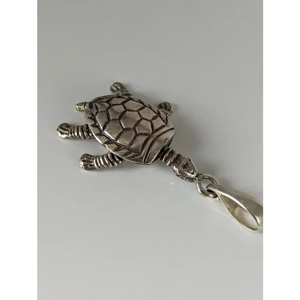 Silver steed tortoise silver pendant with detailed textured shell and limbs in shiny silver pendant design