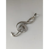 Silver steed treble clef silver pendant in silver with intricate design and polished metallic finish