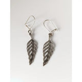 Silver steed tropical leaf dropped earrings with silver leaf shape and intricate veining details in dangle style
