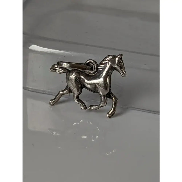 Silver steed trotting horse silver pendant with detailed sculpted features and loop for easy attachment
