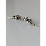 Silver steed tulip stud earrings with silver leaf shape, polished finish, subtle texture, and central spherical accent
