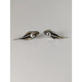 Silver steed tulip stud earrings with silver leaf shape polished finish and round central accent in metallic style