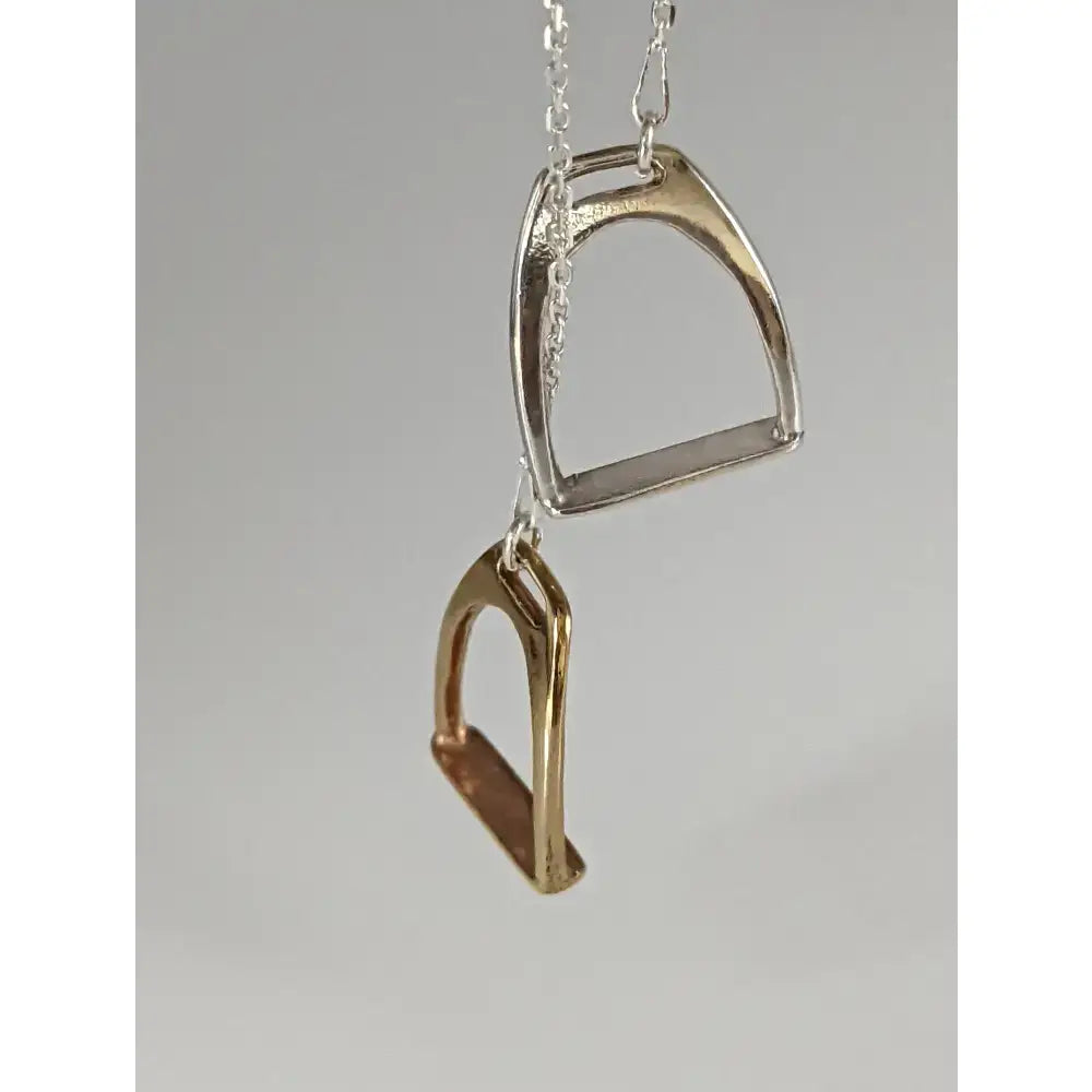 Silver steed two stirrups necklace pendant featuring silver and gold design in stirrups necklace style equestrian jewelry