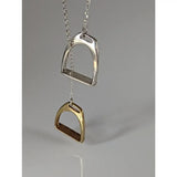 Silver steed two stirrups necklace featuring a silver and gold horse stirrup pendant with chain stirrups necklace