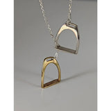 Silver steed equestrian jewelry featuring a silver and gold-toned two stirrups necklace with chain