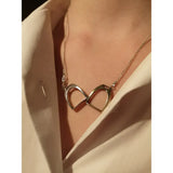 Silver steed two stirrups necklace featuring a silver infinity symbol pendant on a delicate chain, perfect stirrups necklace