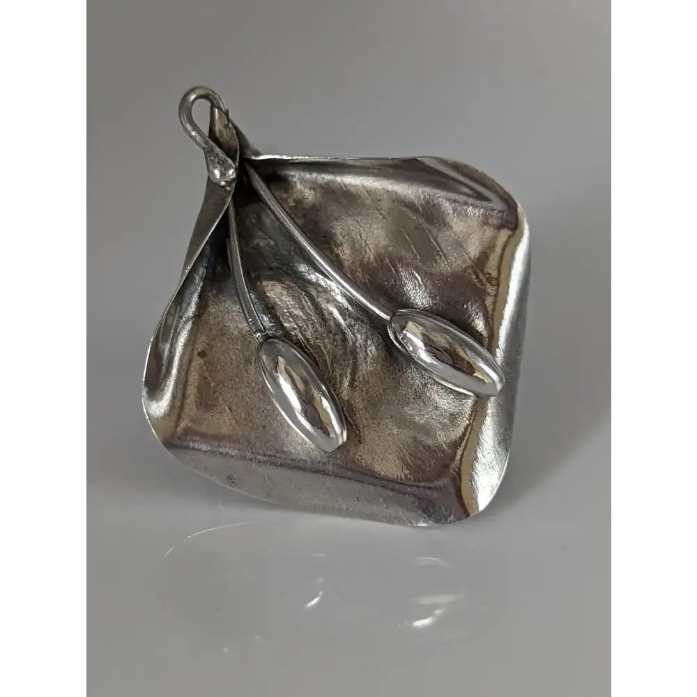 Silver steed unique silver-toned hand-forged pendant with textured square base and elongated spoon-like details