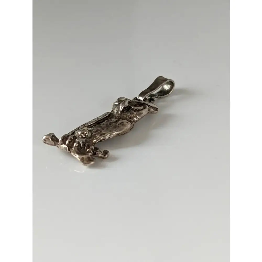 Silver steed wise owl silver pendant featuring a silver dachshund pendant with intricate hat details