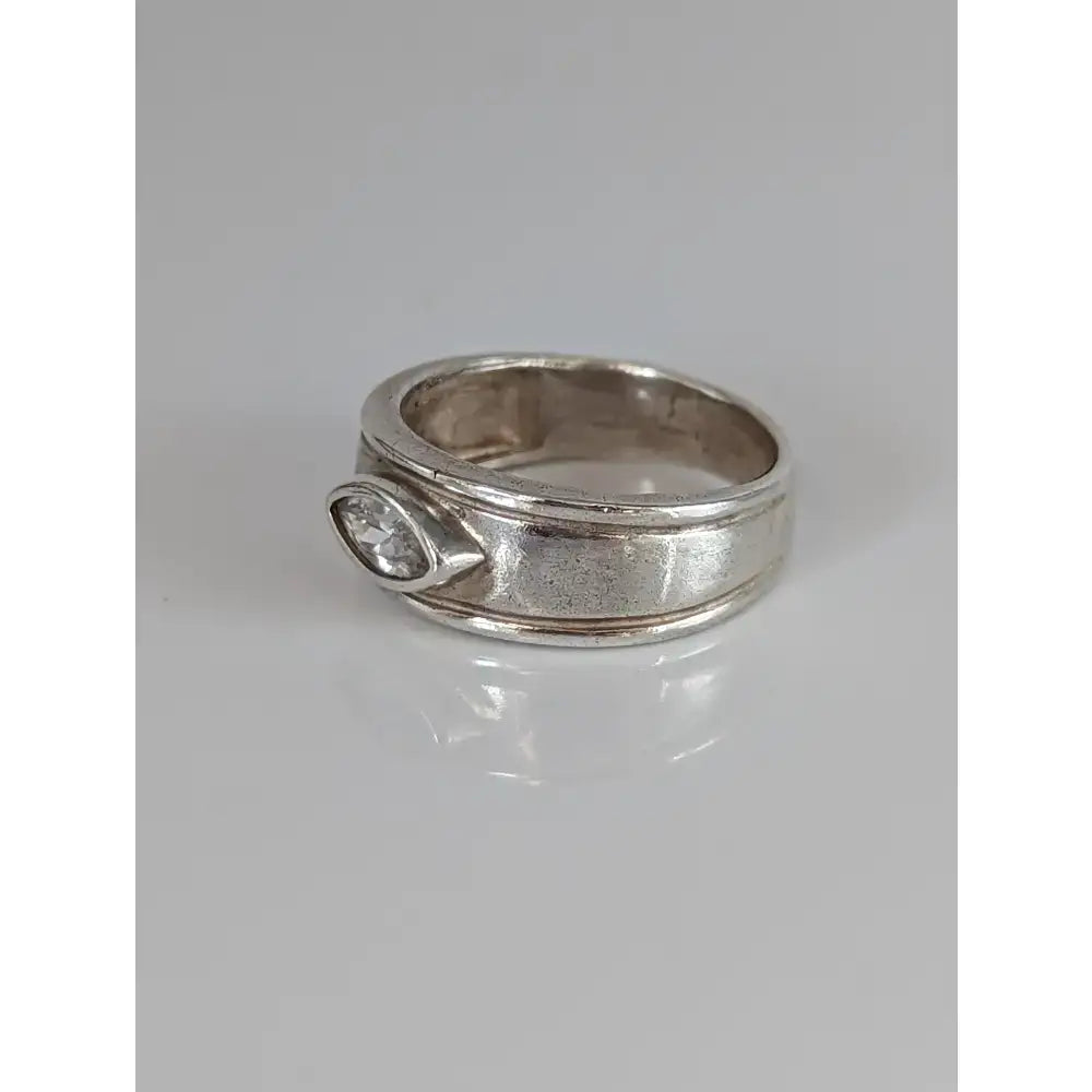 Silver steed silver zirconia band with a textured silver finish and oval-cut clear gemstone in a sleek design