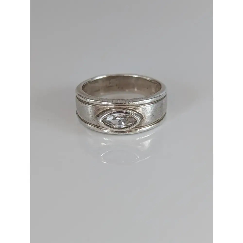 Silver steed silver zirconia band with marquise-cut clear gemstone and textured sides with two grooves