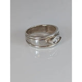 Silver steed zirconia textured silver zirconia band with oval cut clear gemstone set on the side