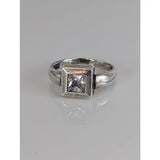 Silver steed zirconia square ring features a clear zirconia square gemstone set in a textured silver band