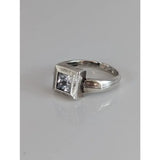Silver steed zirconia square ring with clear square-cut gemstone set in textured geometric silver band