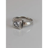 Silver steed zirconia square ring with a clear square-cut gemstone set in a textured geometric silver band