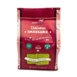A vibrant red package of silvermoor unicorn grassabix with glossy finish and playful unicorn branding showing green forage blocks