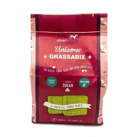 A vibrant red package of silvermoor unicorn grassabix with glossy finish and playful unicorn branding featuring green forage blocks
