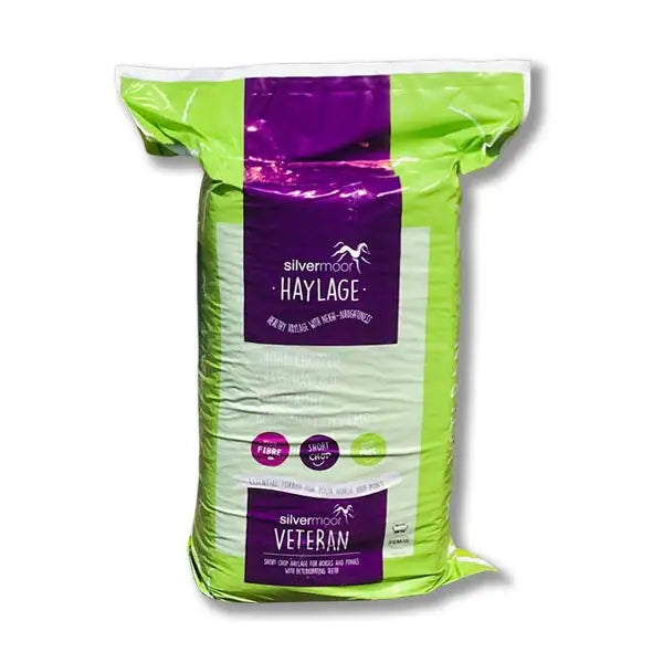 A vibrant lime green and purple bag of silvermoor haylage veteran 20 kg short chop rye grass haylage with bold label