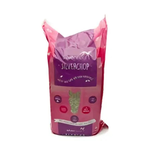 A vibrant pink and purple bag of silvermoor silver chop alfalfa potting soil with a clear window showing green plant material