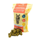 Yellow and orange packaged silvermoor treatsies horse treats labeled tremendous turmeric perfect titbit with horse silhouette