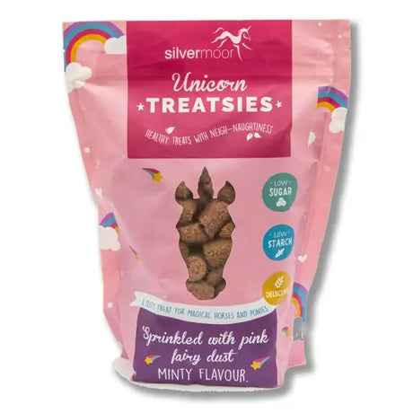 Pink and purple silvermoor unicorn treatsies for four legged friends with brown bites and pink fairy dust visible through window