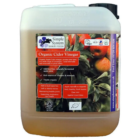 A white plastic jug of amber organic cider vinegar from simple system horse feeds with apples and certification logos