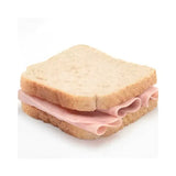 A simple simply sandwiches sandwich with two slices of light brown bread and thinly sliced pink ham layers
