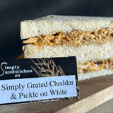 A simply sandwiches white bread sandwich filled with shredded chicken cheddar cheese and pickle relish perfect for bon sweets pouches