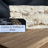 A simply sandwiches layered chicken and stuffing sandwich on white bread with creamy filling and herbs perfect for bon sweets pouches