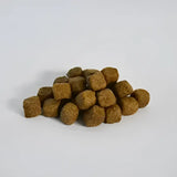 Brown square kibble pieces from skinner’s field & trial lamb & rice dog food complete working dog food