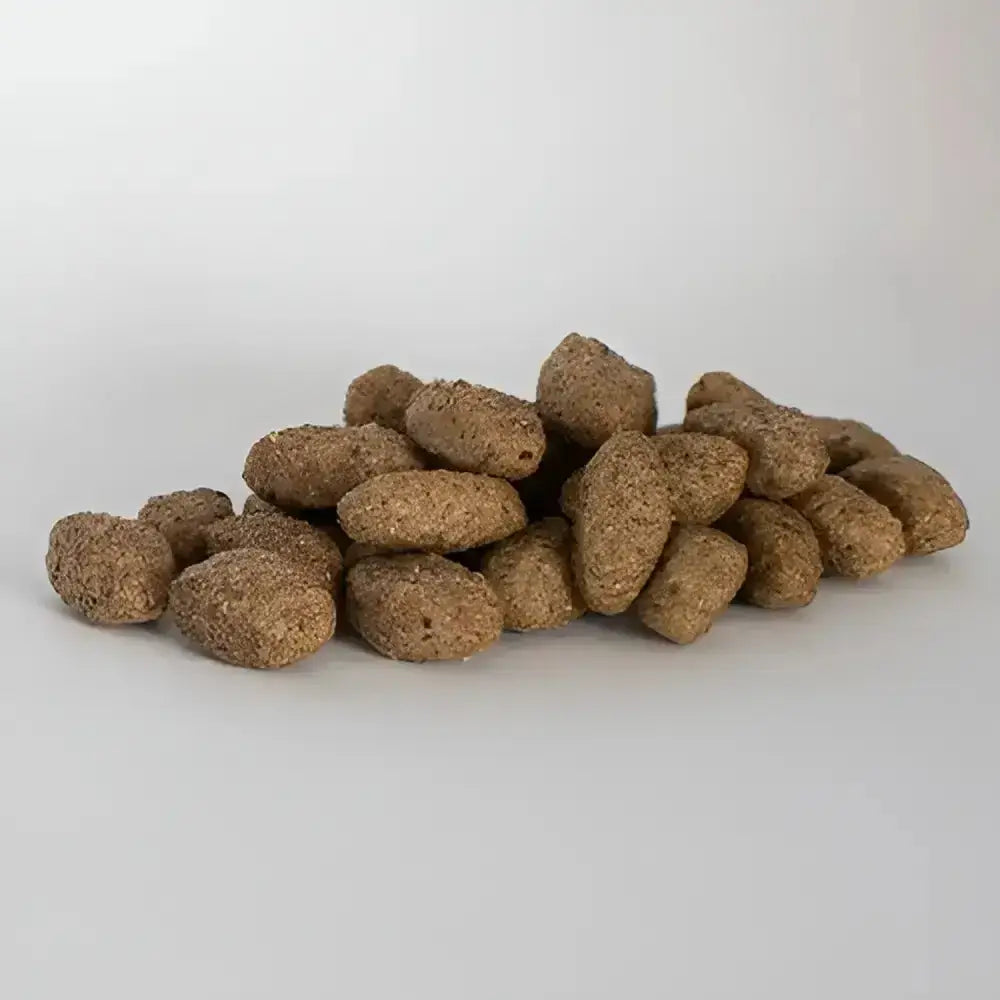 Brown textured kibble pieces from skinners field light and senior complete working dog food for field and trial use