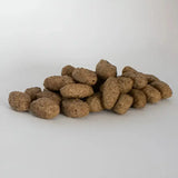 Brown textured kibble pieces from skinners field light and senior complete working dog food for field and trial use