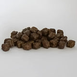 Brown irregular kibble pellets of skinners field and trial complete dry puppy food for growing dogs