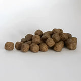 Brown textured kibble pellets from skinners field & trial working crunchy 26 complete working dog food